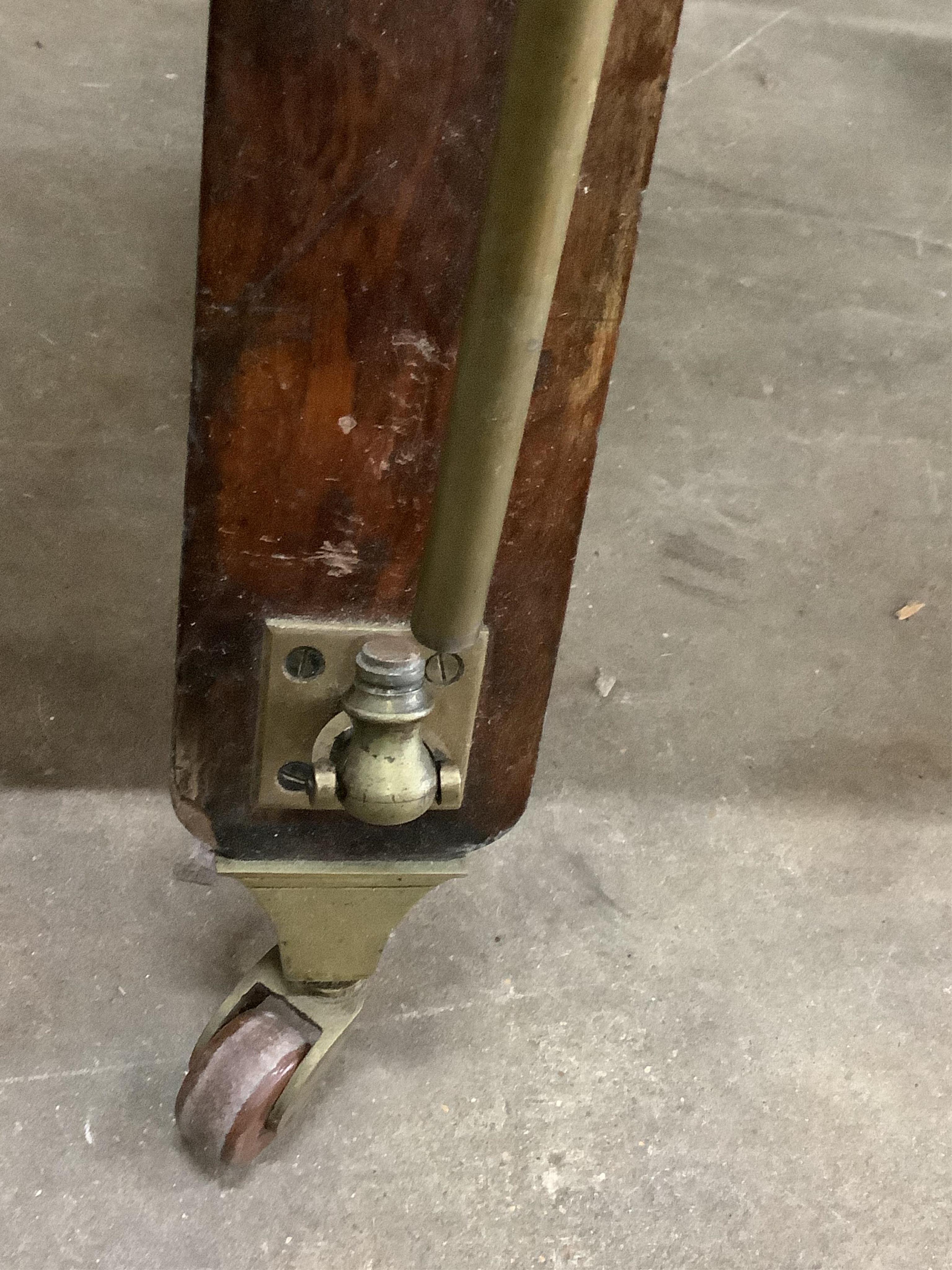 A Victorian brass mounted green morocco folio stand, width 82cm, height 90cm